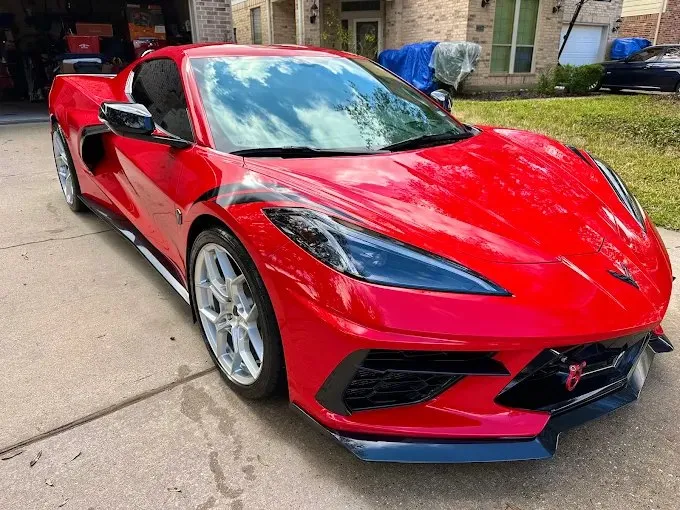 A freshly detailed red Corvette by New Life Supreme Wash